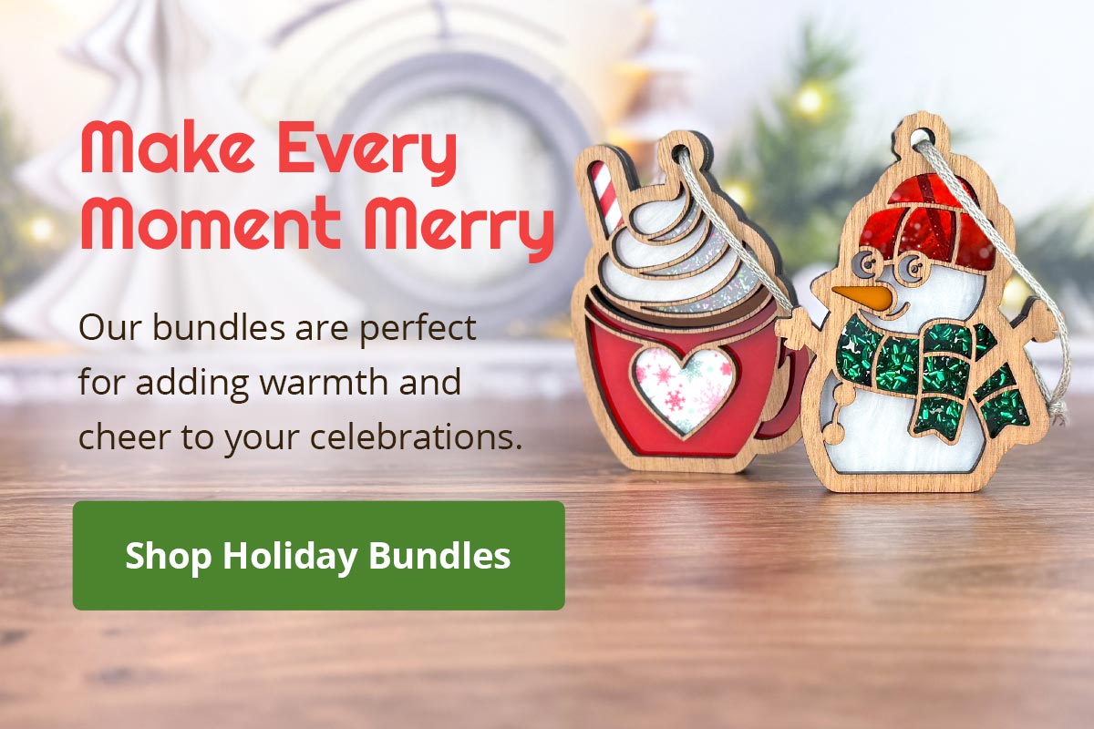 Festive scene with wooden ornaments of a mug with a candy cane and a snowman in a scarf and hat. Text reads, "Make Every Moment Merry. Our bundles are perfect for adding warmth and cheer to your celebrations." A green button says, "Shop Holiday Bundles".