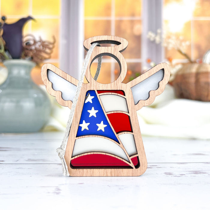 The wooden angel ornament is expertly crafted from sapele wood and vibrant colors. This design features an American flag motif, making it an ideal choice for police retirement gifts. The combination of the rich wood texture and the vivid colors of the flag creates a striking and meaningful keepsake. This handcrafted piece honors the service and dedication of retiring police officers, providing a heartfelt and patriotic tribute to their commitment and bravery.