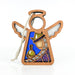A charming addition to your Christmas nativity collection, this 3.5-inch wooden angel figurine from Forged Flare®'s Mother's Angels® series is adorned with a depiction of a wise man holding a potion. It features a blue background enhanced with golden glitter and comes with a white string for hanging, making it the perfect ornament for your festive decorations.
