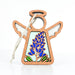 The Texas Bluebonnet Ornament from Forged Flare®, part of the Mother's Angels® collection, is a 3.5" wooden angel figurine with a braided linen string attached for hanging. This ornament is perfect for a Christmas tree, featuring a stained glass-style insert that showcases a blue floral design and green leaves reminiscent of Texas bluebonnets. With its white background, it exudes a simplistic and elegant look.